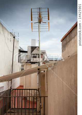 Television antenna on the roof of a house 14425901