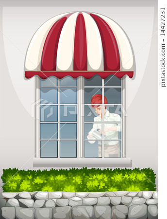 A waiter near the window A waiter near the window 14427231
