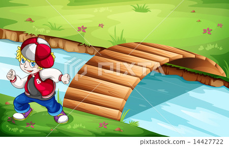 A hiphop dancer dancing near the wooden bridge A hiphop dancer dancing near the wooden bridge 14427722