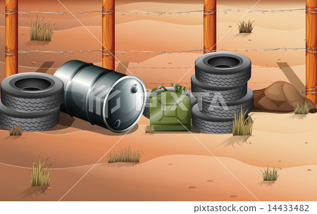Wheels and fuel containers near the barbwire fence 14433482