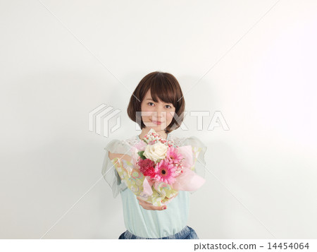 A young woman giving flowers 14454064