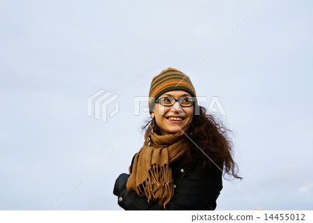 The girl in a cap and a scarf The girl in a cap and a scarf 14455012