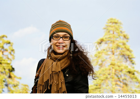 The girl in a cap and a scarf 14455013