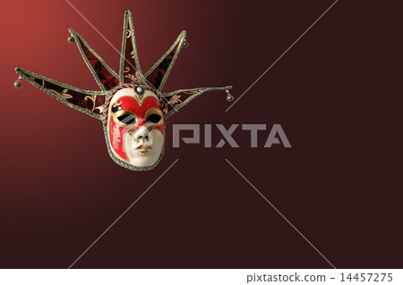 Traditional Venetian mask on burgundy background Traditional Venetian mask on burgundy background 14457275