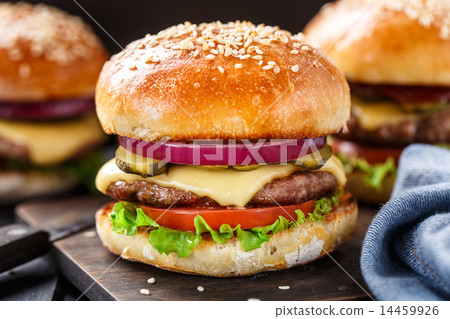 Delicious burger on wooden board Delicious burger on wooden board 14459926
