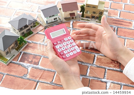 Person's hand who is afflicted with purchasing my home 14459934