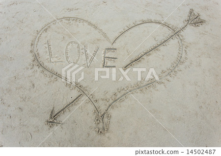 heart with an arrow drawn on sand heart with an arrow drawn on sand 14502487