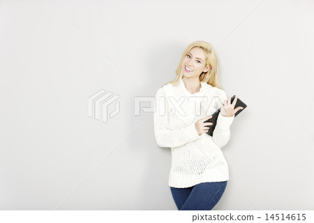 Woman holding a computer tablet Woman holding a computer tablet 14514615