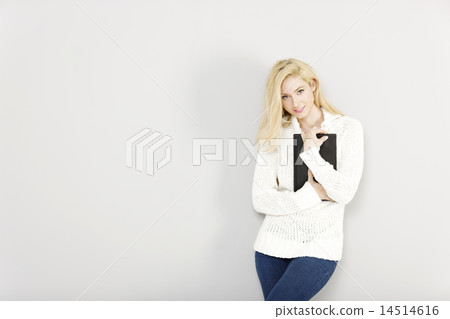 Woman holding a computer tablet Woman holding a computer tablet 14514616