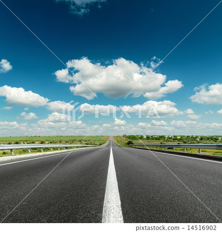 deep blue cloudy sky over asphalt road deep blue cloudy sky over asphalt road 14516902