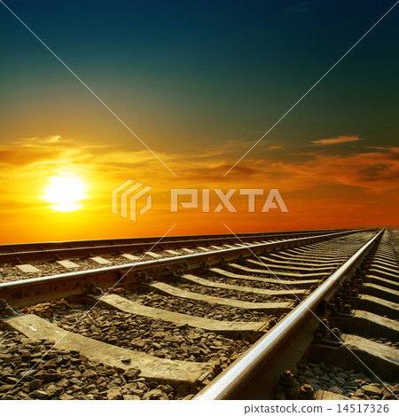 orange sunset over railroad 14517326