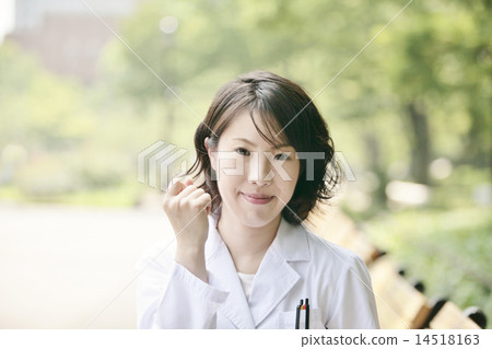 A lady in white suit to support 14518163