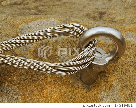 Detail of steel anchor eye and rope end in rock Detail of steel anchor eye and rope end in rock 14519491