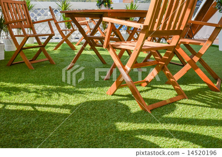 wooden chairs and table on the green grass wooden chairs and table on the green grass 14520196