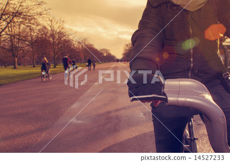 man riding a bicycle in Hyde Park in London, UK man riding a bicycle in Hyde Park in London, UK 14527233
