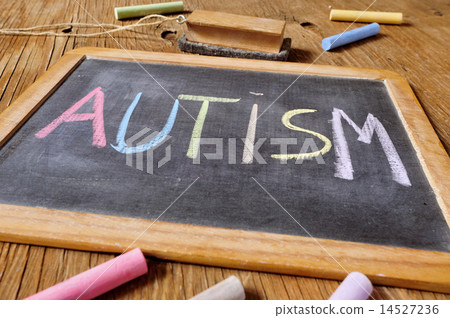 word autism written in a chalkboard 14527236