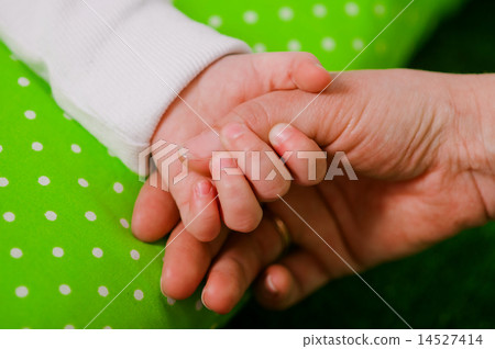 Hand of a little baby in mother's hand Hand of a little baby in mother's hand 14527414