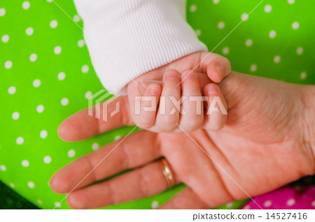 Hand of a little baby in mother's hand Hand of a little baby in mother's hand 14527416