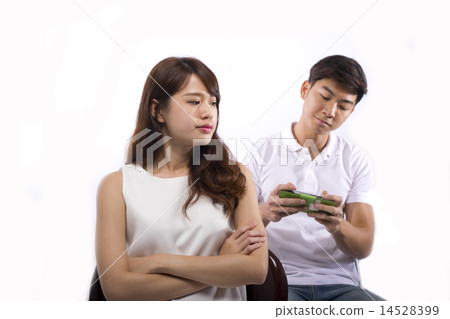 Young lady angry with man neglecting her 14528399