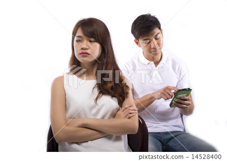 Young lady angry with man neglecting her 14528400