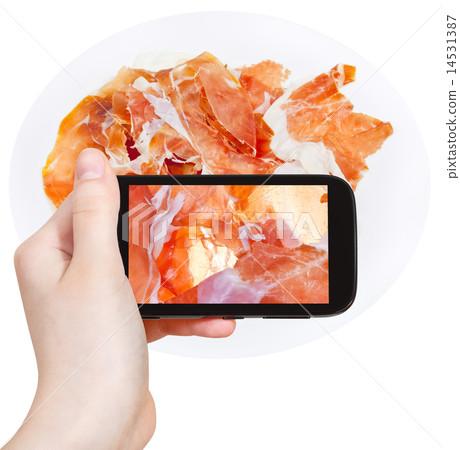 tourist photographs sliced ham Prosciutto di Parma 14531387