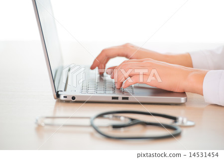 Female doctor with computer Female doctor with computer 14531454