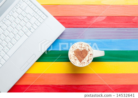 Cup of cappuccino with heart shape and computer Cup of cappuccino with heart shape and computer 14532641