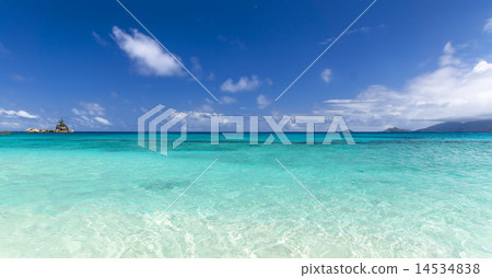White coral beach sand and azure indian ocean. White coral beach sand and azure indian ocean. 14534838
