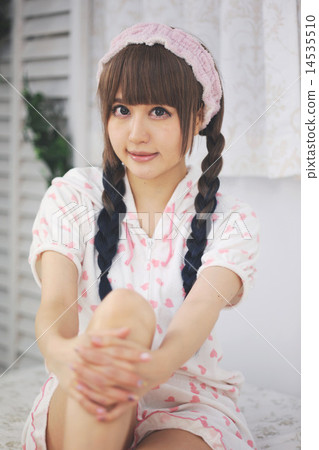 A woman in her room with her pajamas 14535510