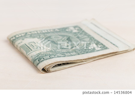 used US banknotes on wood table close up used US banknotes on wood table close up 14536804
