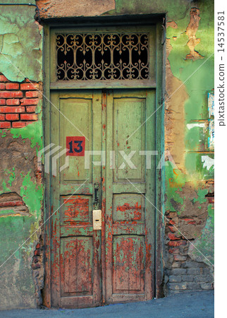 The old grunge wooden door with peeling paint The old grunge wooden door with peeling paint 14537581