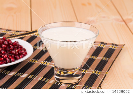 Milk with grains of pomegranate Milk with grains of pomegranate 14539062