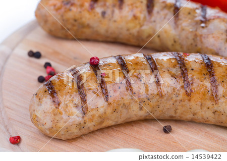 Close up of fried sausages on wood. Close up of fried sausages on wood. 14539422