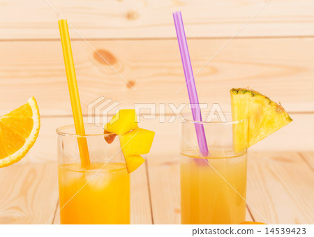 Orange juice and slices on wooden background. Orange juice and slices on wooden background. 14539423