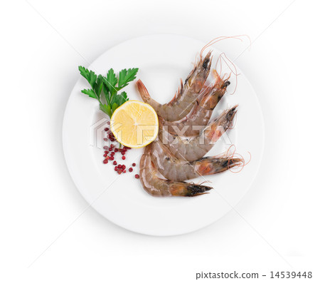 Raw shrimps on white plate. 14539448