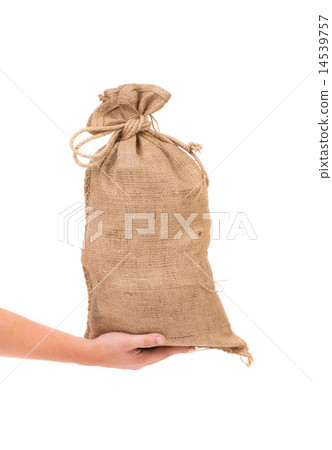 Hand holds bag with euro banknotes. 14539757