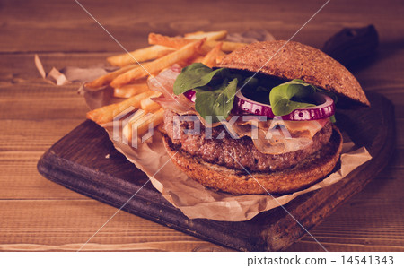 Burger and french fries close up on vintage style. 14541343