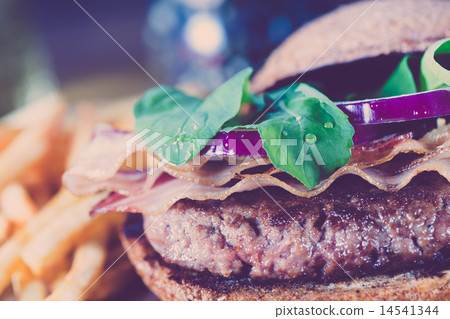 Burger and french fries close up on vintage style. 14541344