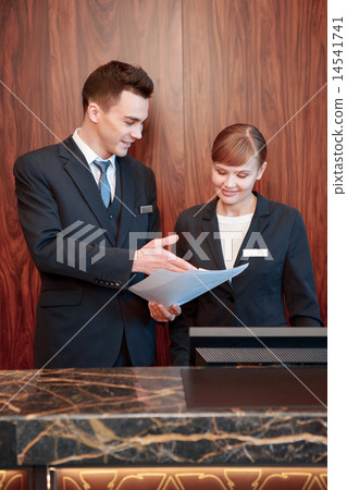 图库照片: hotel receptionists behind the counter