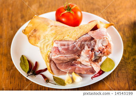 pork shank on a plate with spices 14543199
