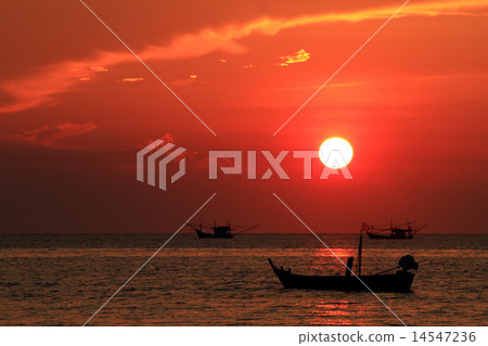 silhouette of boat  with yellow and orange sun  14547236