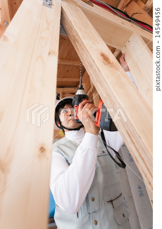 Carpentry working at home construction site 14549456