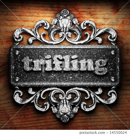 trifling word of iron on wooden background trifling word of iron on wooden background 14550024
