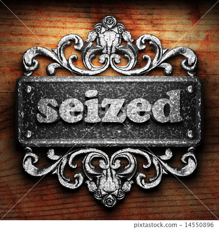 seized word of iron on wooden background 14550896