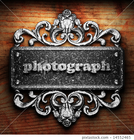 photograph word of iron on wooden background 14552465
