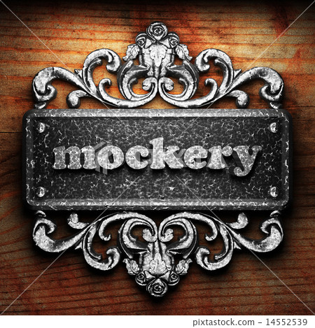 mockery word of iron on wooden background 14552539