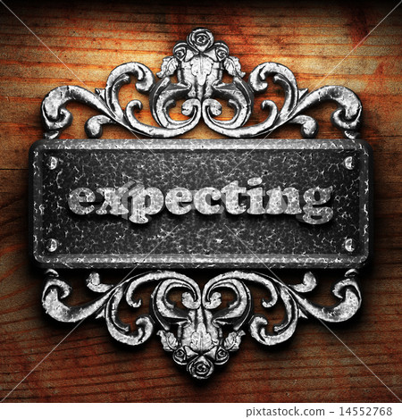 expecting word of iron on wooden background 14552768
