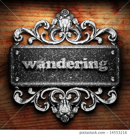 wandering word of iron on wooden background wandering word of iron on wooden background 14553218