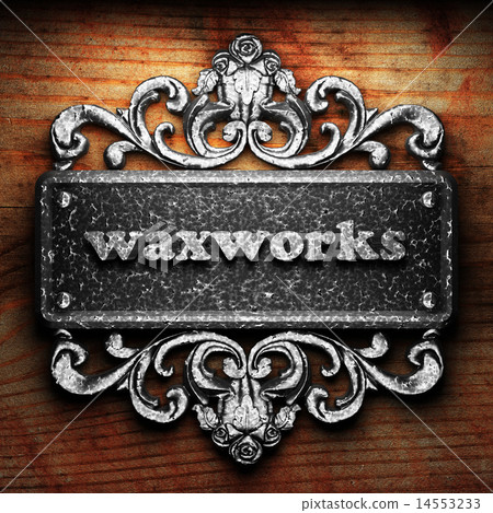 waxworks word of iron on wooden background waxworks word of iron on wooden background 14553233