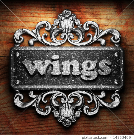 wings word of iron on wooden background 14553409